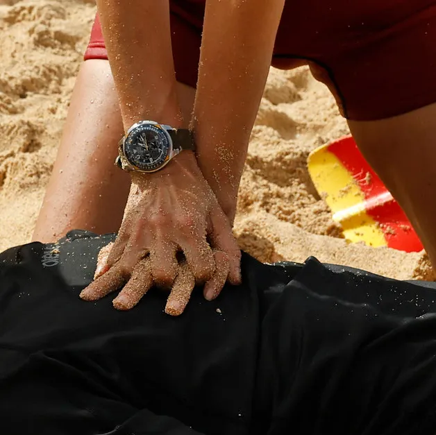 Watch on wrist in coastal setting
